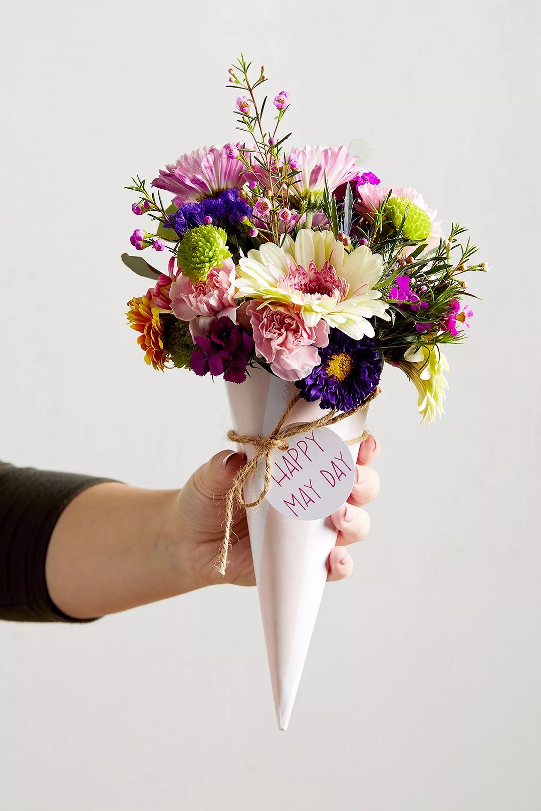 flower bouquet wrapped in pretty paper for may day