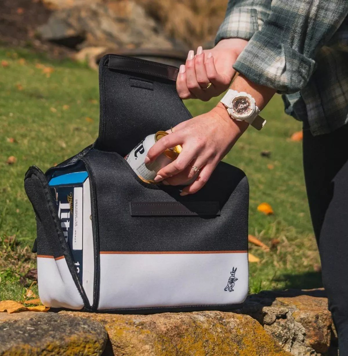 hands holding a beer cooler