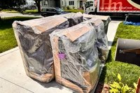 A photo of the delivery of Ashley Furniture Emilia 5-Piece Leather Modular Sectional