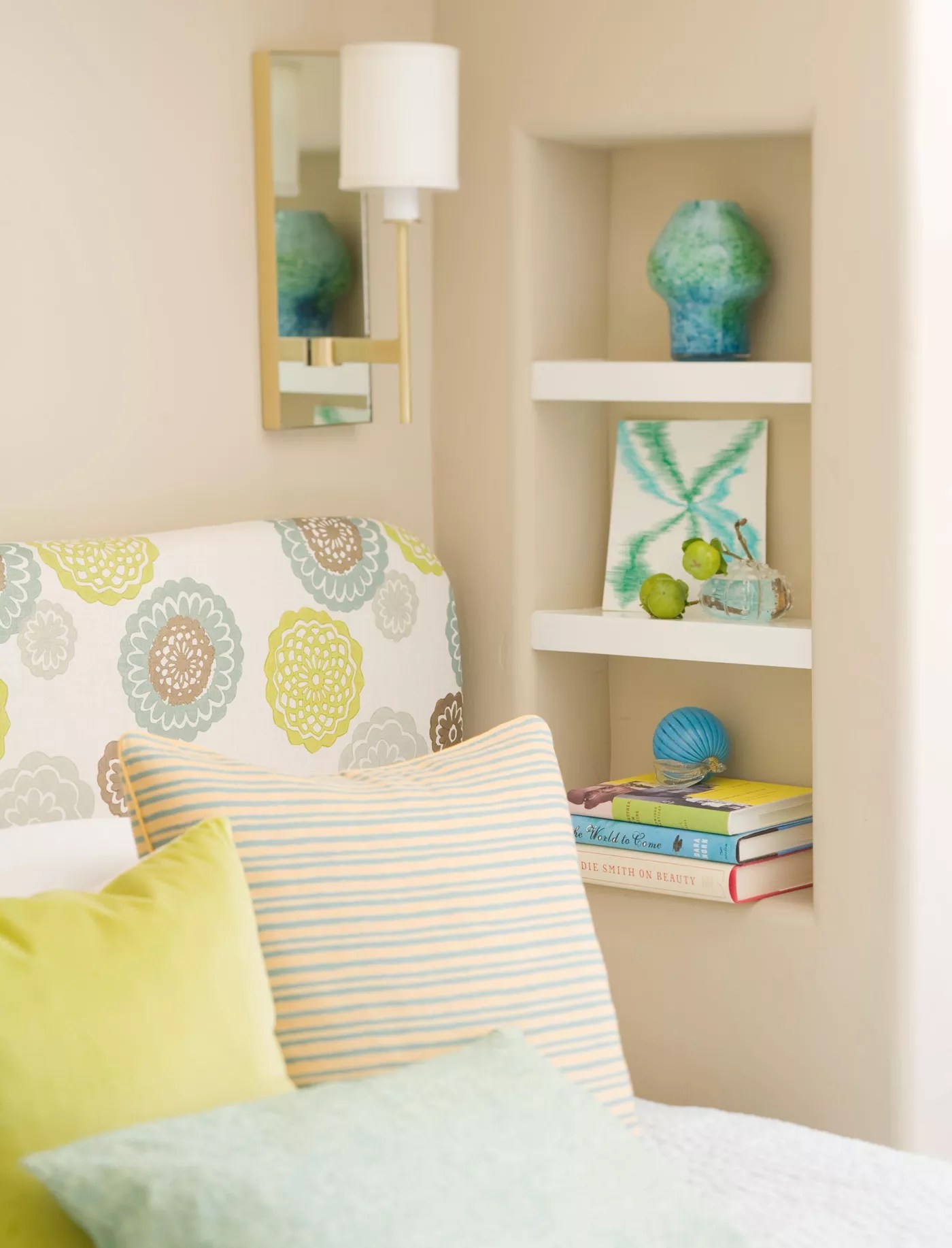 bedside wall nook with white floating shelves