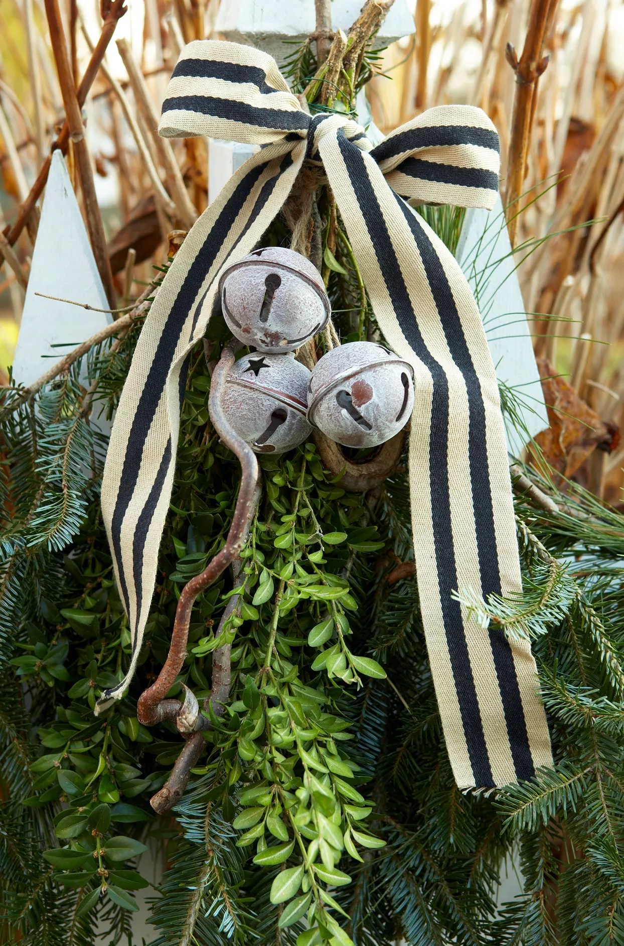 greenery decorated with jingle bells and ribbon