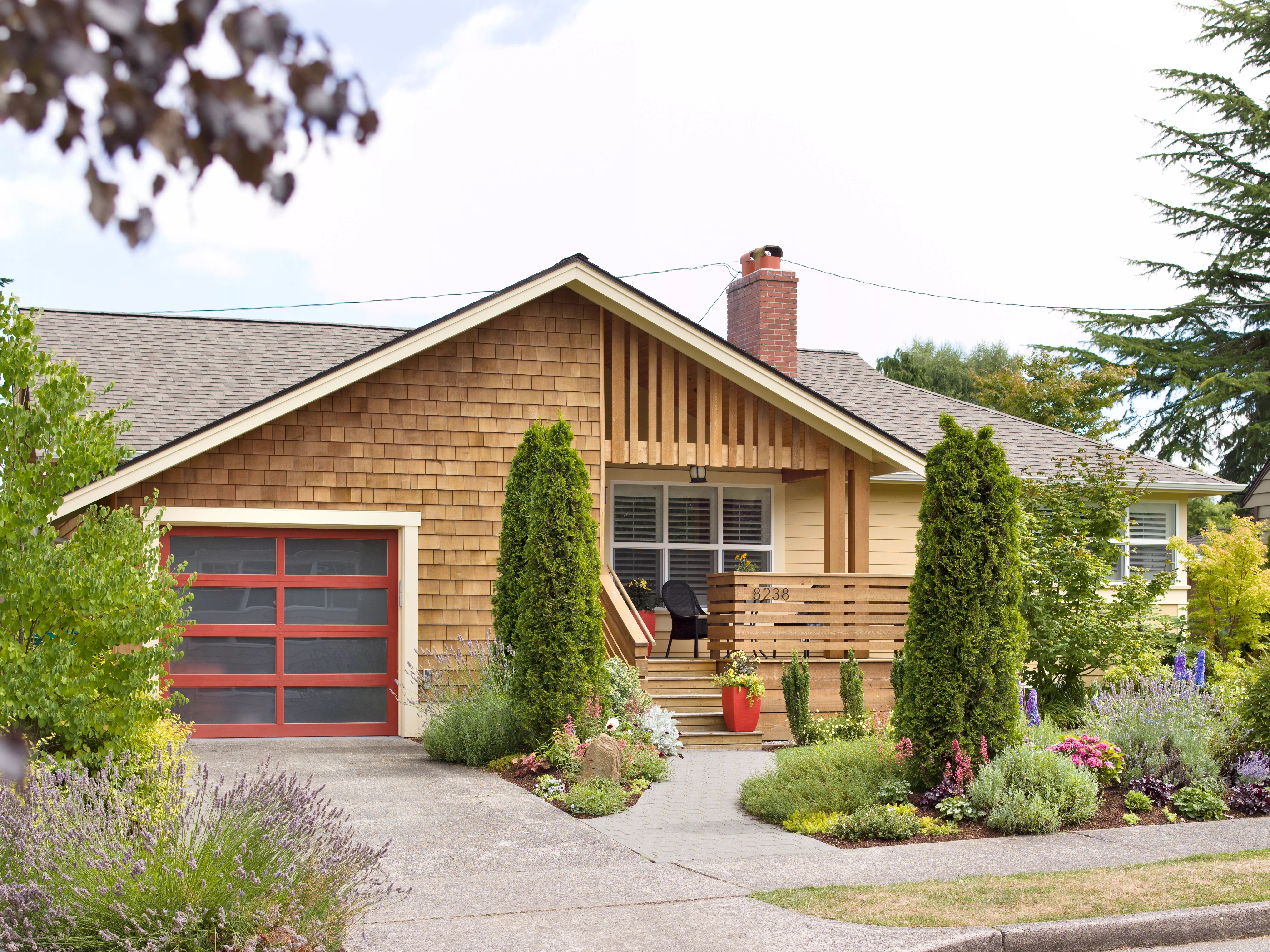 Front landscaping in front of house with garage and driveway