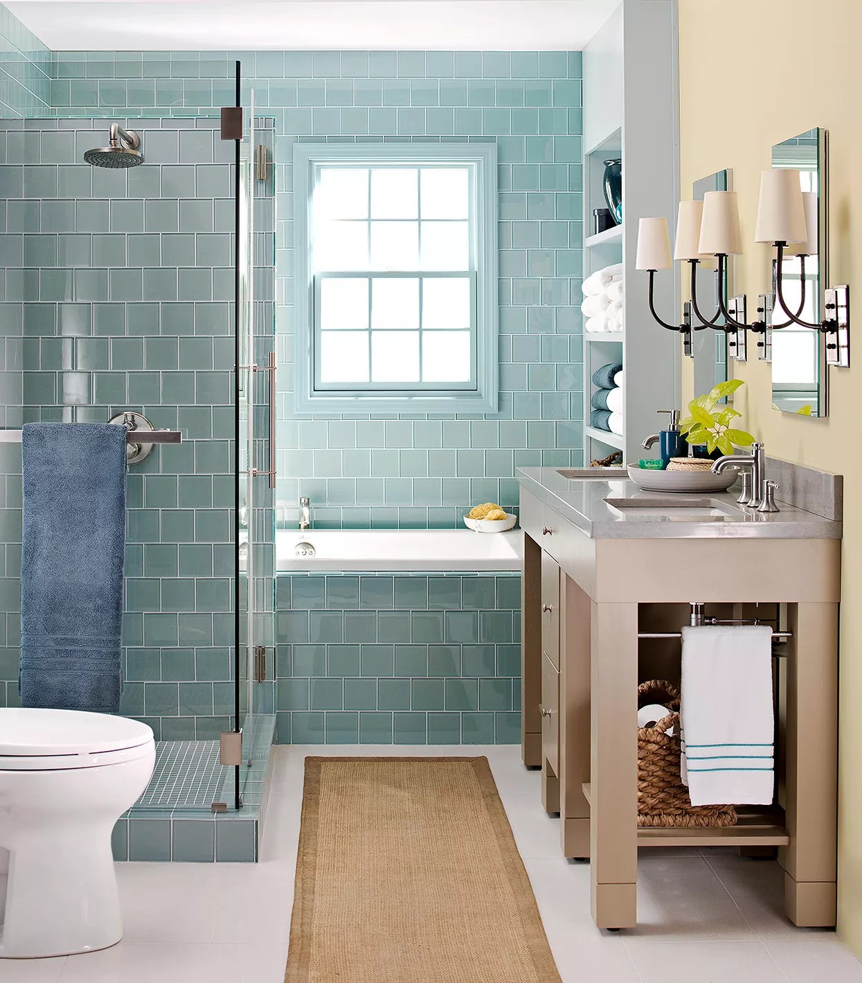 bathtub tucked between shower and window in small bath