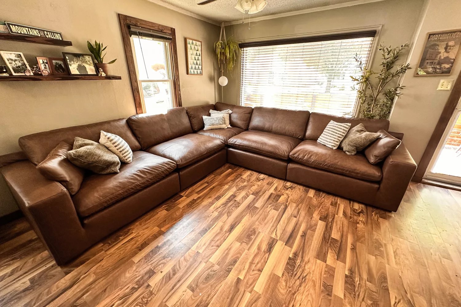 Overall view of the Ashley Furniture Emilia 5-Piece Leather Modular Sectional in a living room corner
