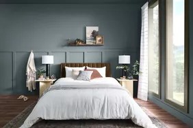 dark gray blue bedroom paint color with white bedding