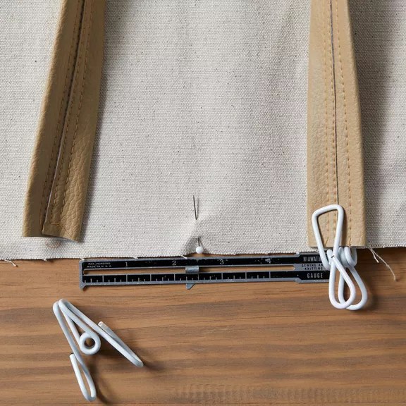 canvas clamped and pinned with sewing gauge