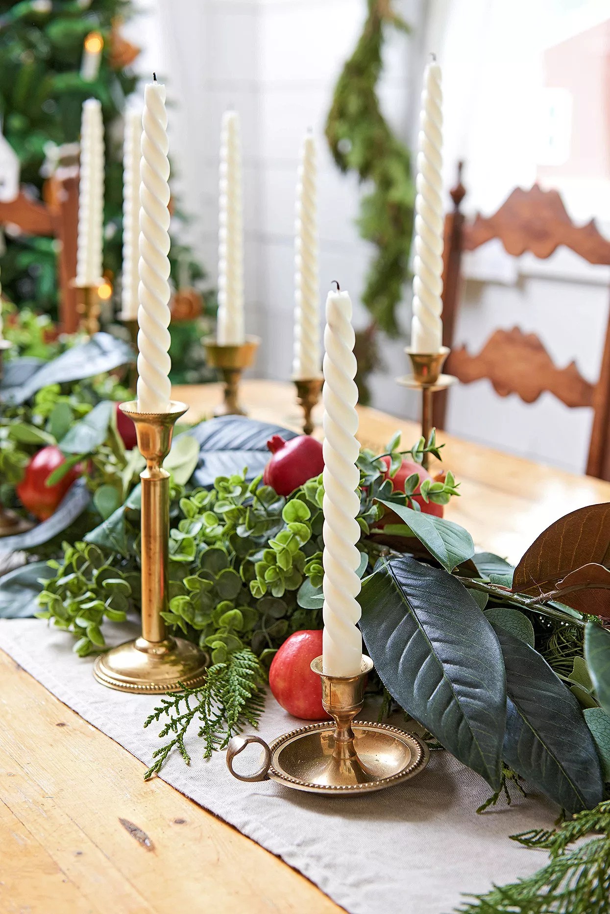 Christmas centerpiece with pomegranates and candles