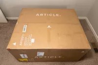 The Article Abisko Sofa in the shipping box from Article