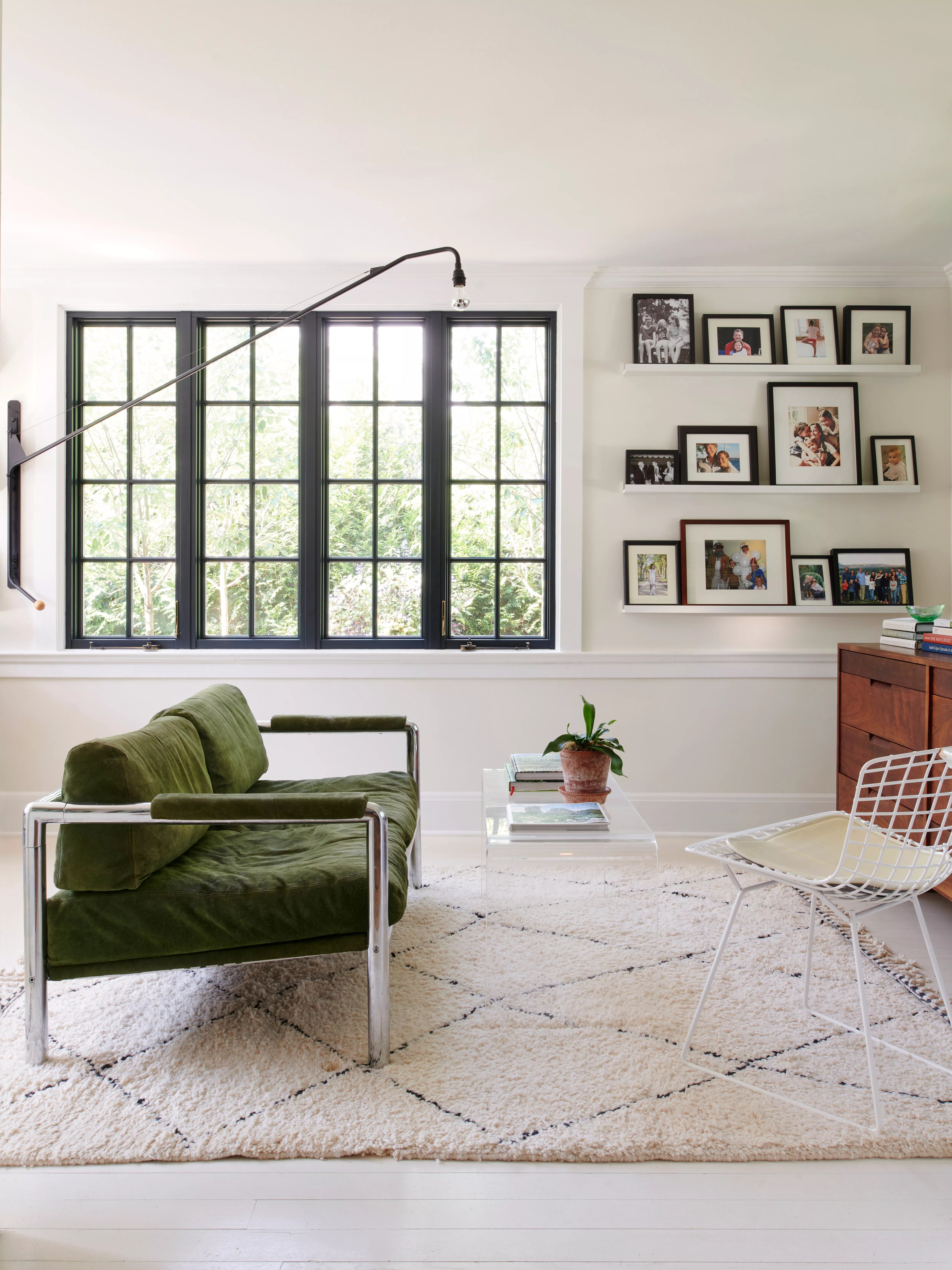Living room with crittall windows and a green couch