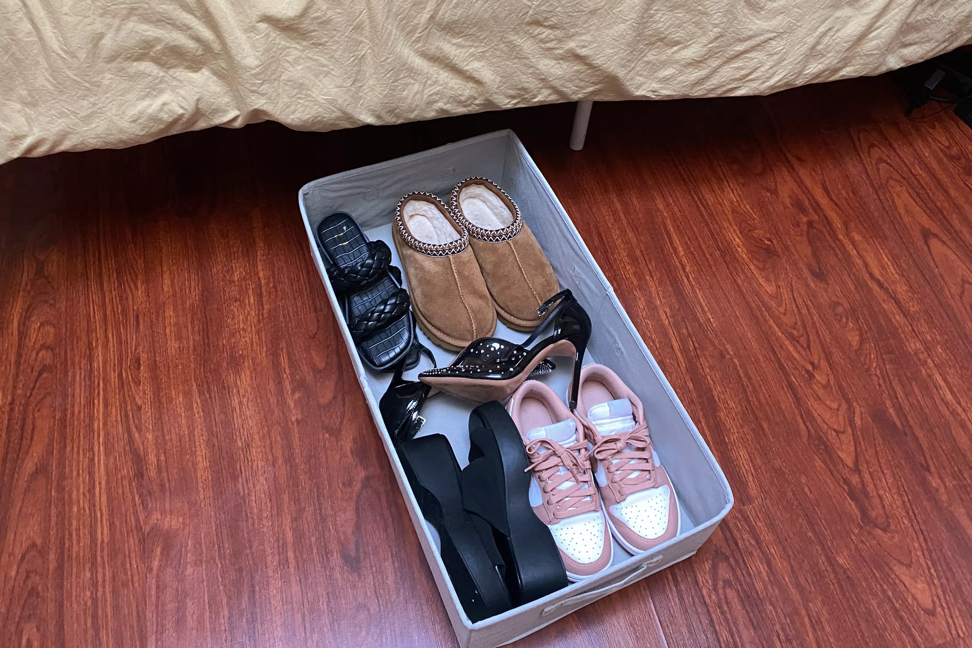 The Brightroom Underbed Fabric Bin with Lid Light Gray on a wooden floor