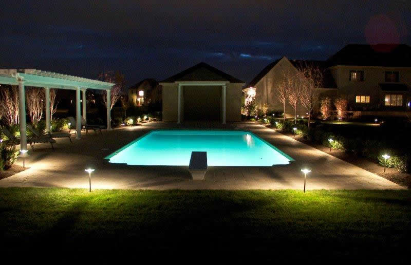 Above Path Lights surrounding the pool area, as well as spot lights