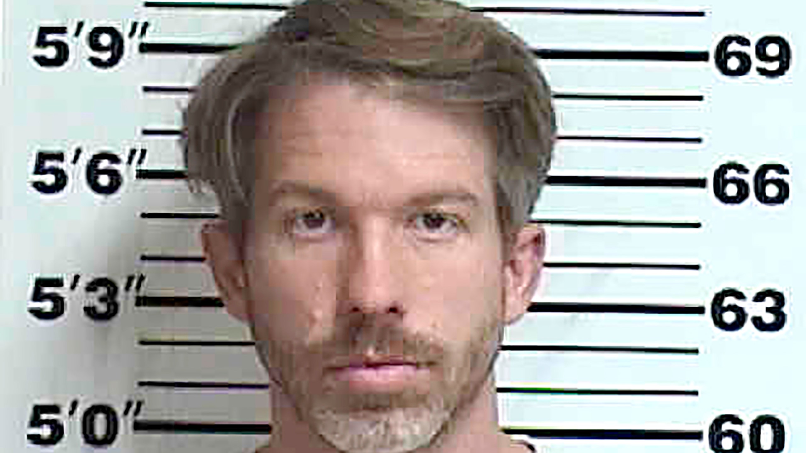 Iowa prosecutor charged over deportation threats to doctor