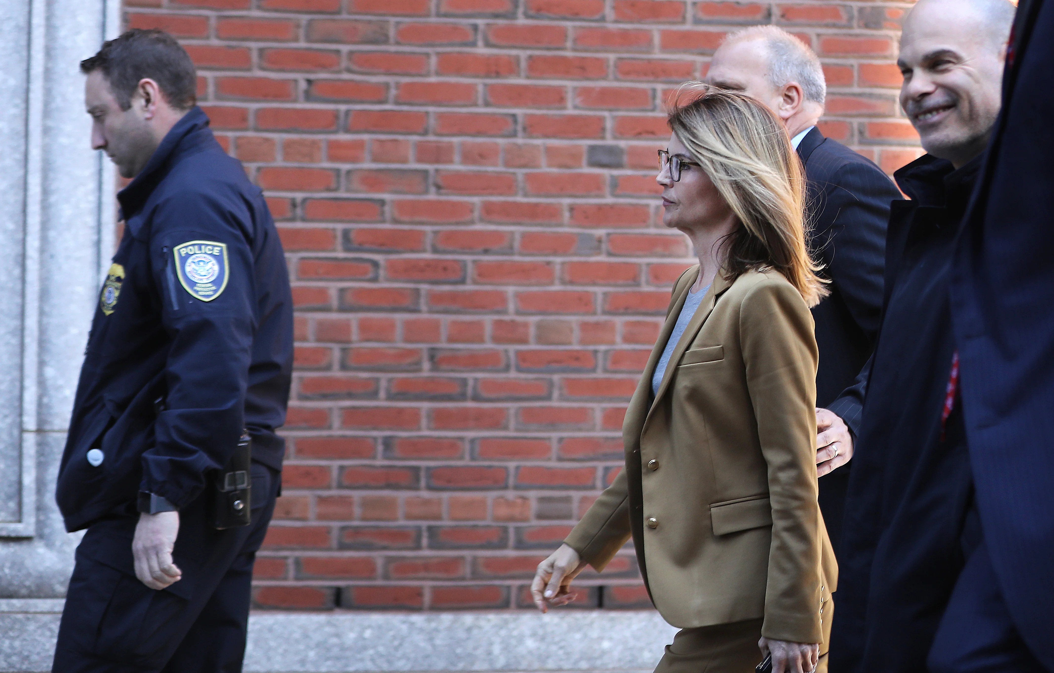 See photos of Felicity Huffman, Lori Loughlin arriving in court to face