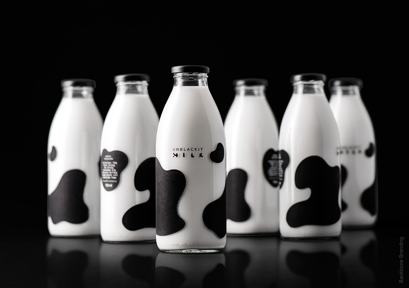 Milking Cow's Spots Portrayed on a Milk Bottle