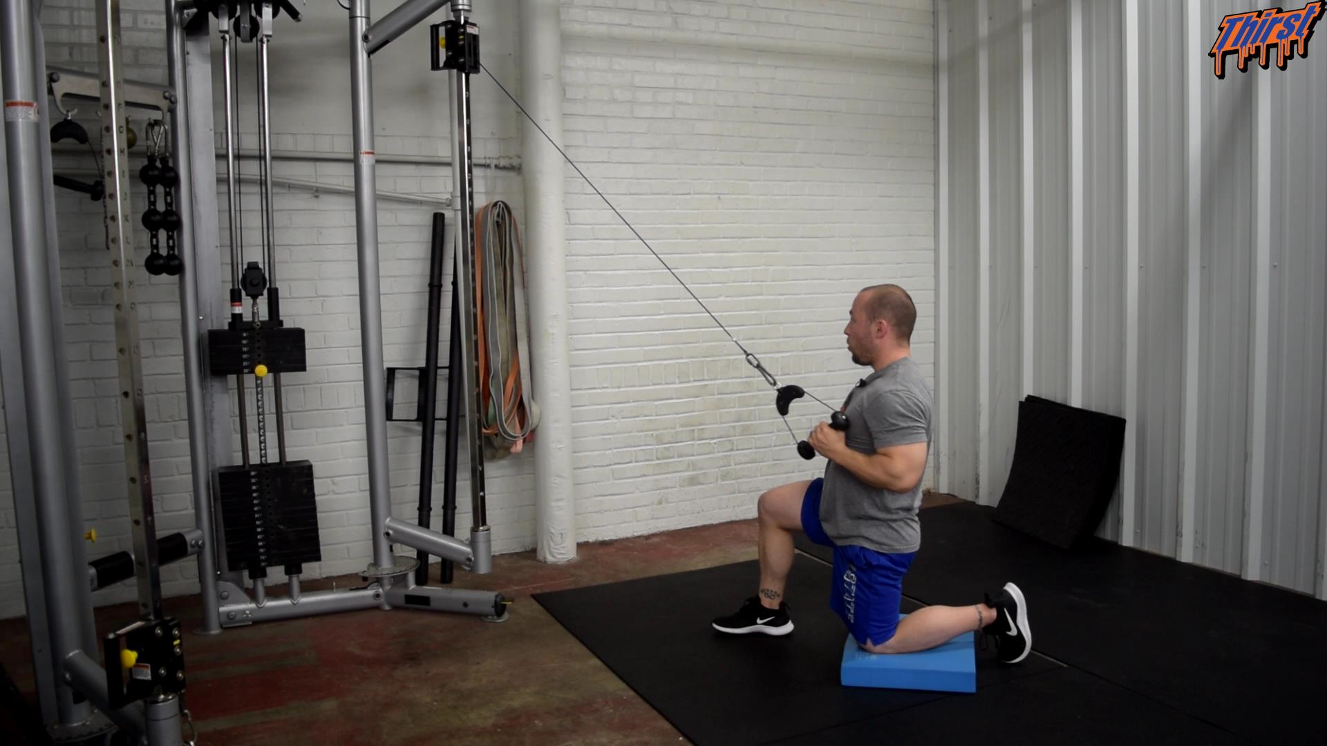 Half Kneeling High Cable Row THIRST