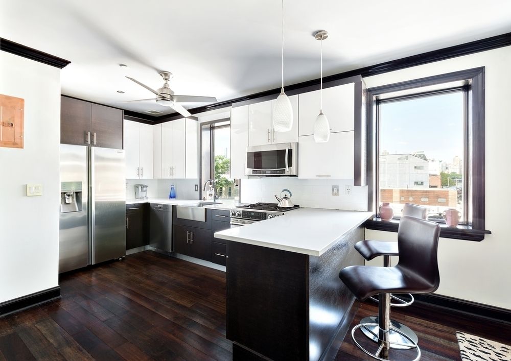 This Astoria duplex comes with a roof deck, balcony, and heated parking