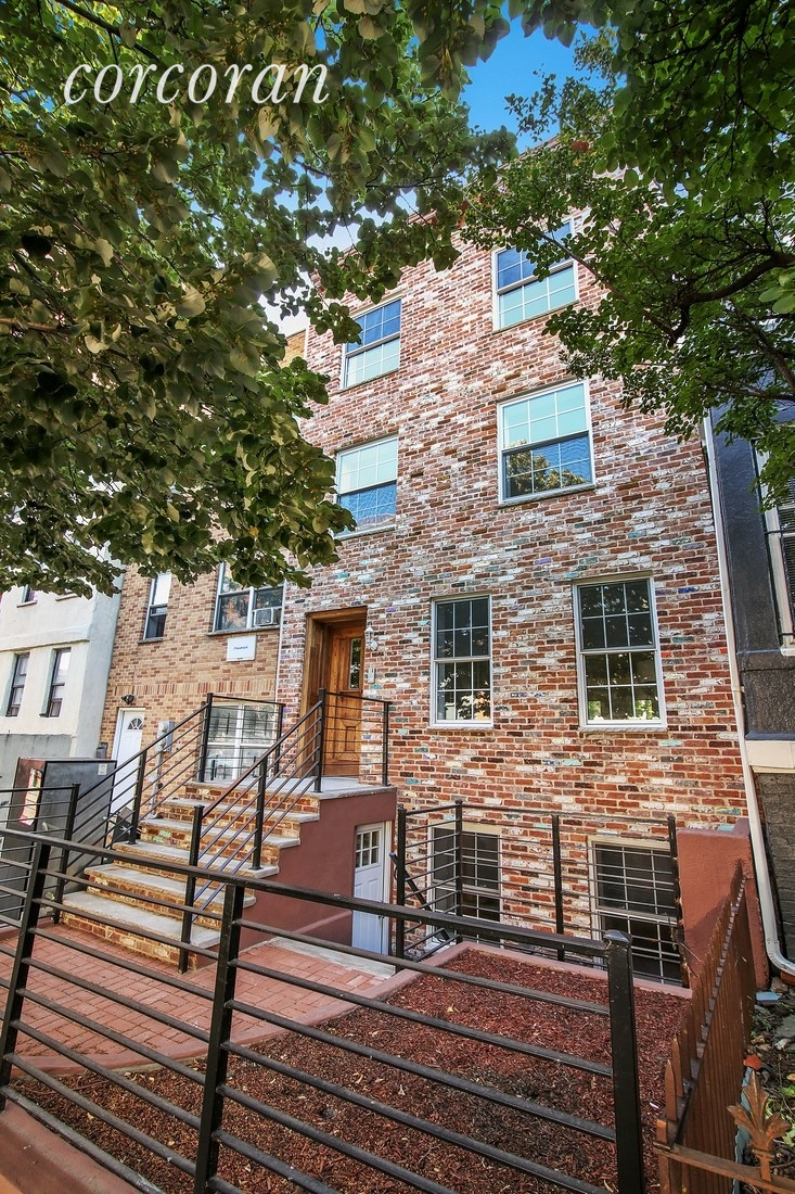 This Fort Greene townhouse offers a roomy triplex and a large rental