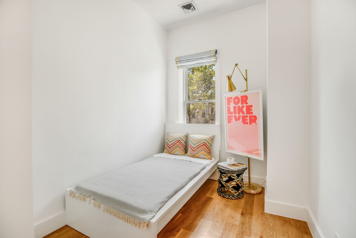 This threebedroom Greenwood townhouse comes with a yard, a deck, and a rental unit