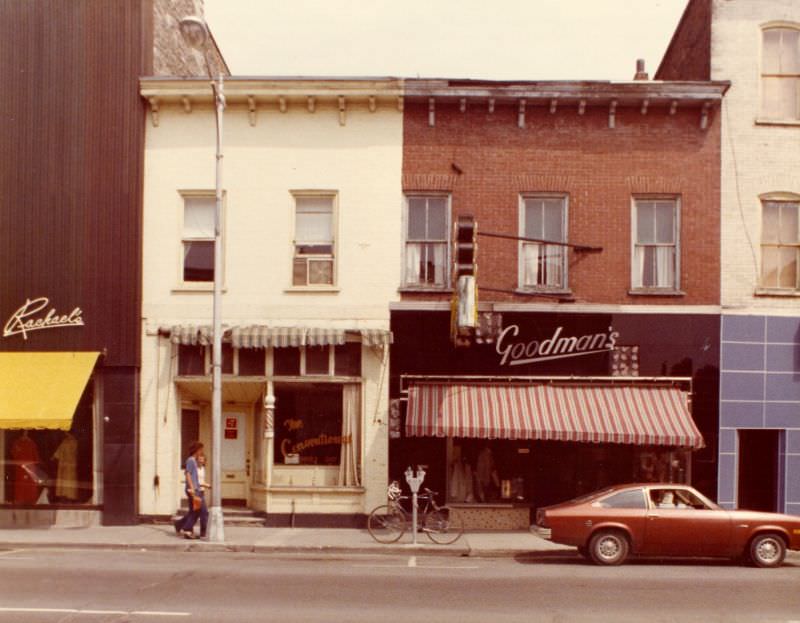 Goodman's store at 307 and Conventional Barber's Shop at 309 Front