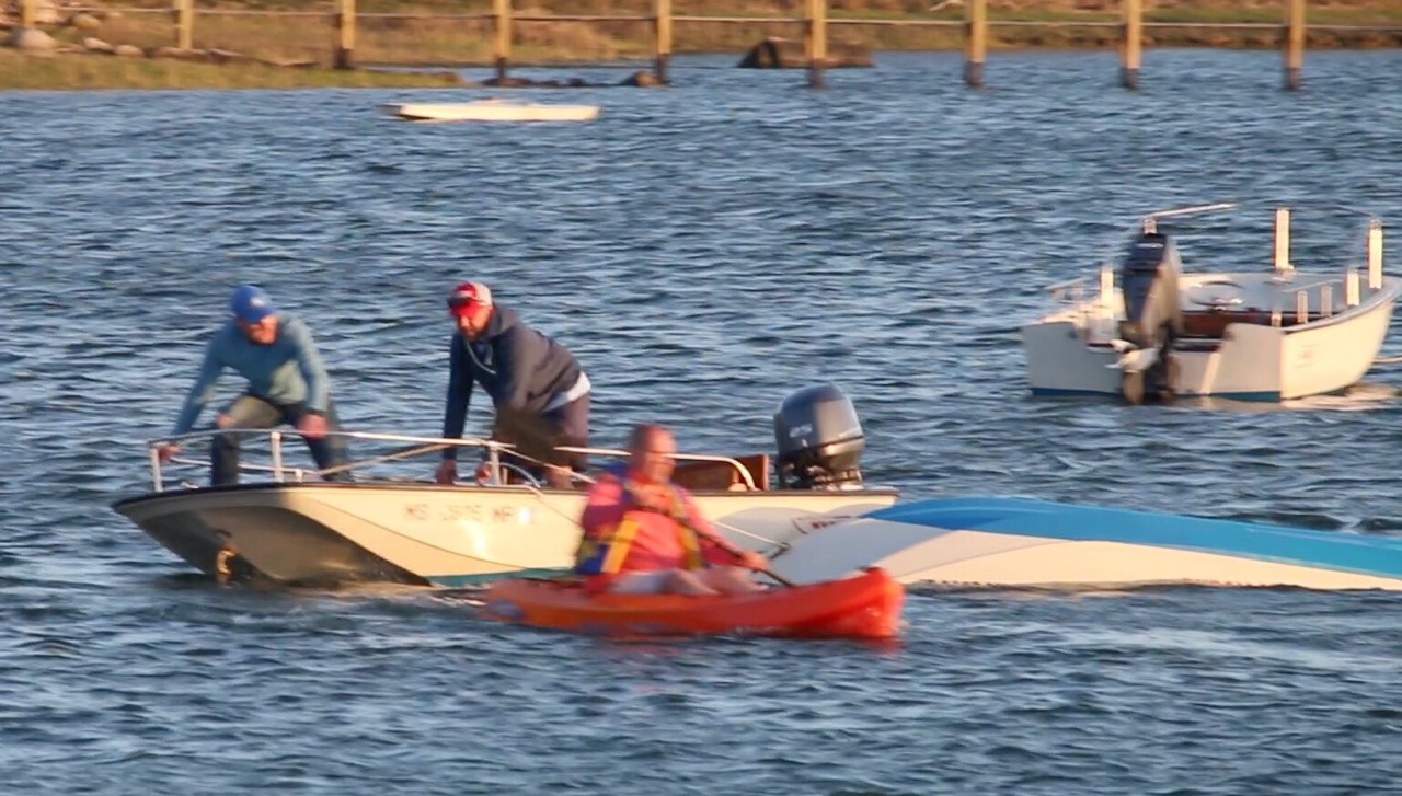 Three rescued after boat capsizes off Bourne