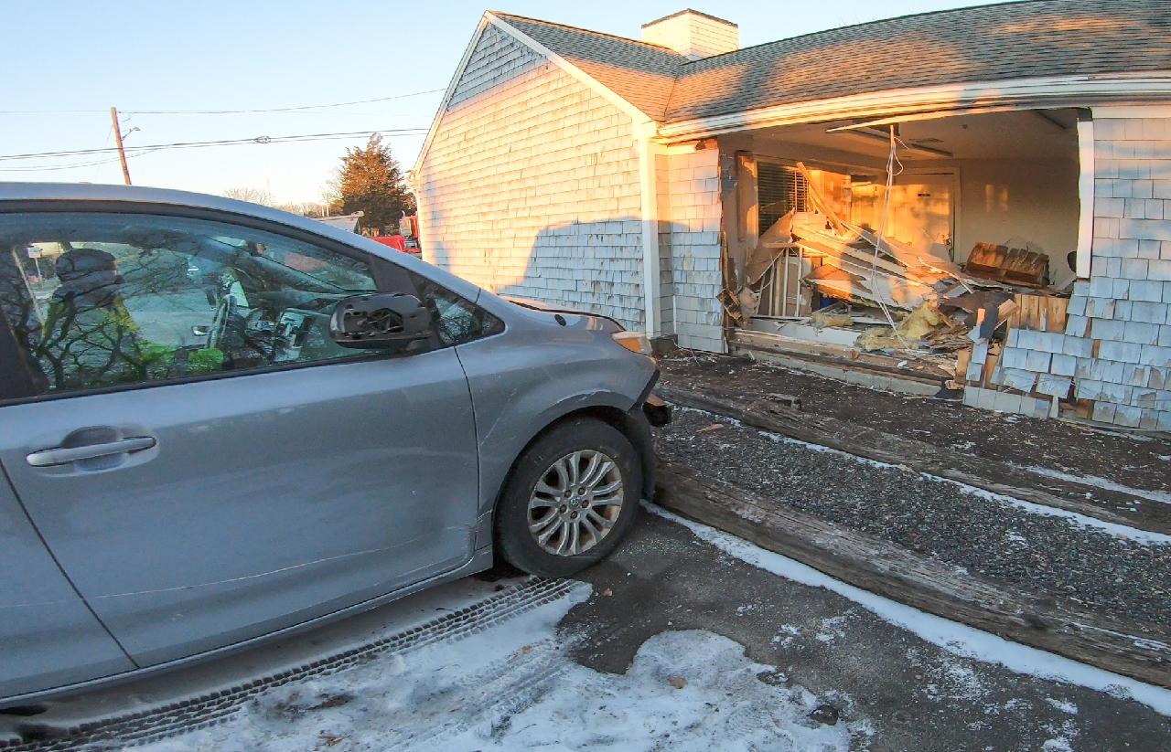 Car strikes real estate building off Mashpee Rotary