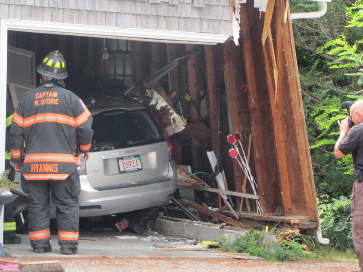 Car crashes into garage of house in Hyannis
