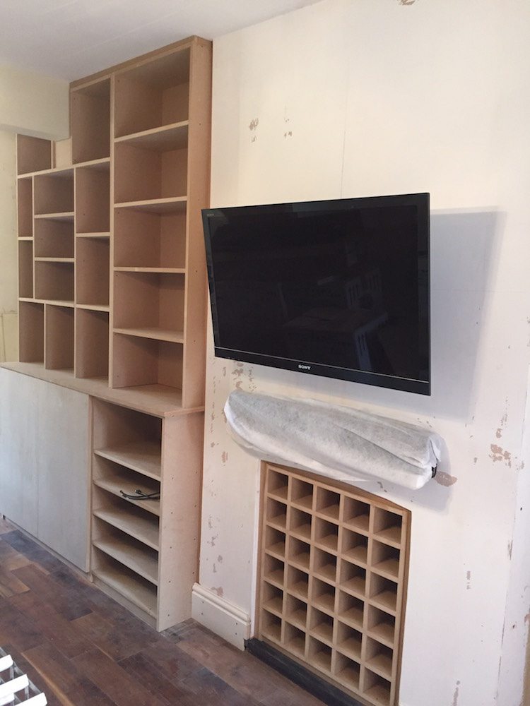 Bookcase & Fireplace Wine Rack Carpentry by Craig Ross