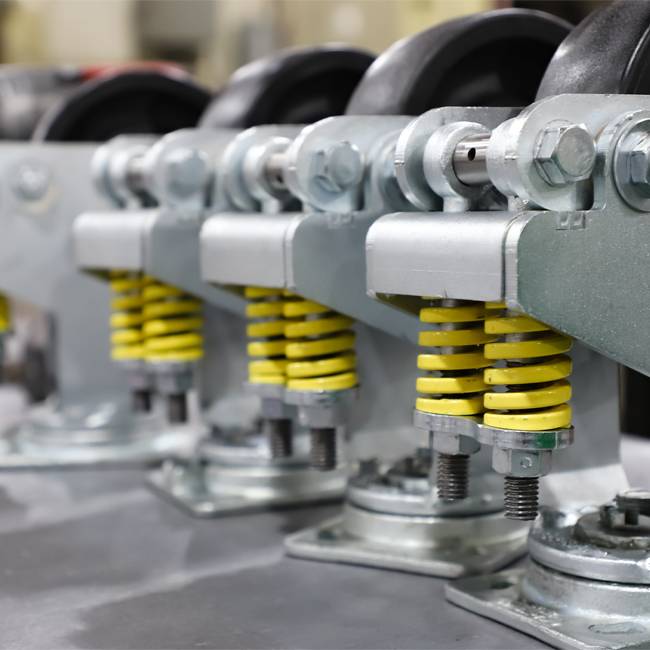 Spring Loaded Casters Absorb Shock to Protect Loads