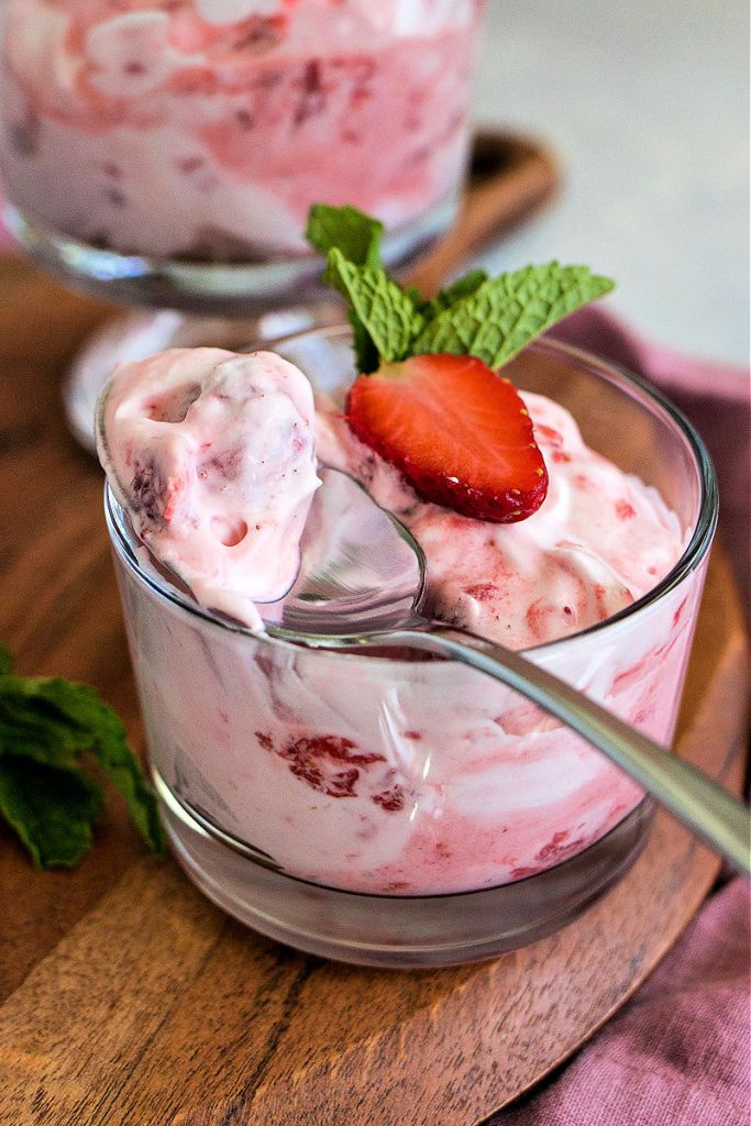 spoonful of mixed berry fool sitting atop the dish