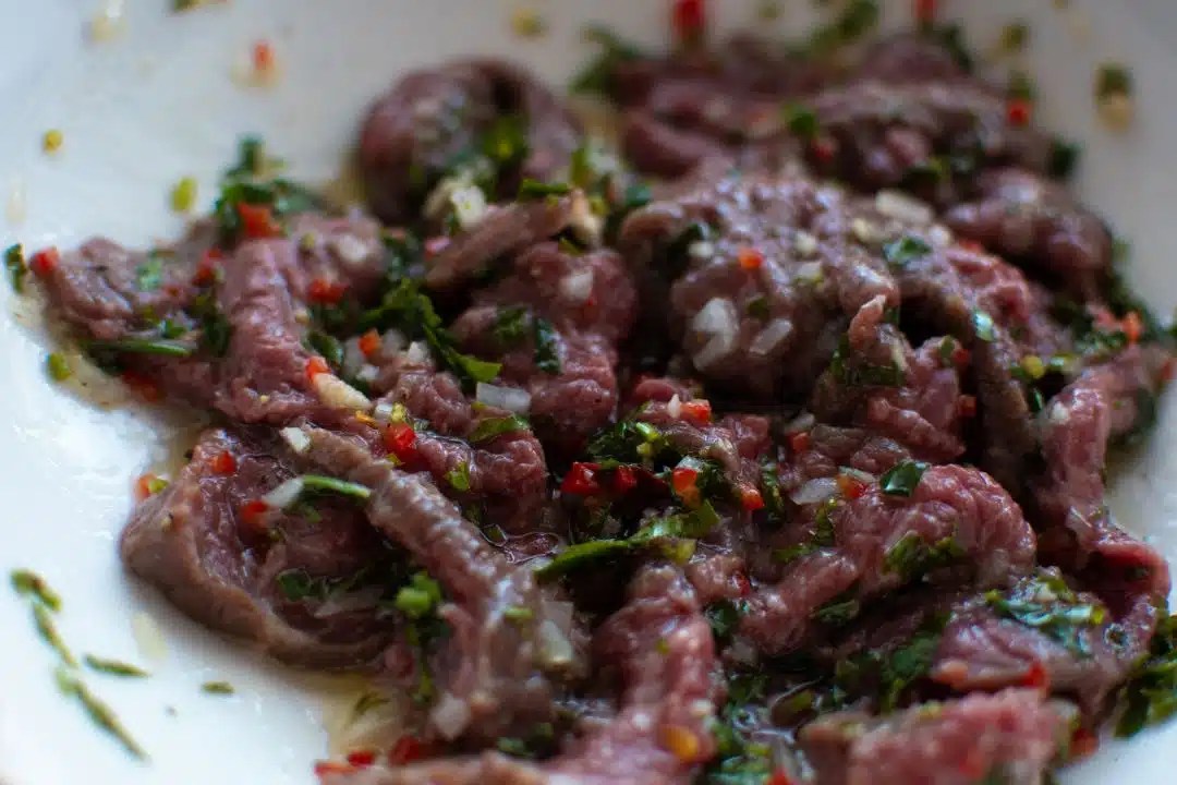 Thinly Sliced Ribeye with Hummus and Capers Chef's Pencil