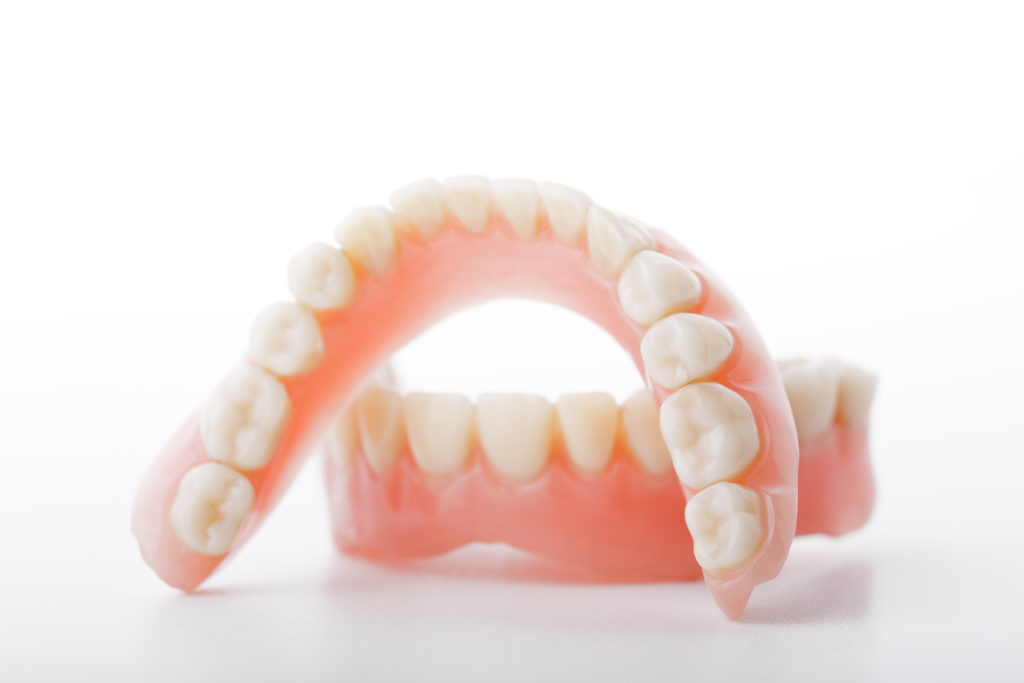 Using Denture Adhesive Dentist in Houston Dr. Cher. Rich