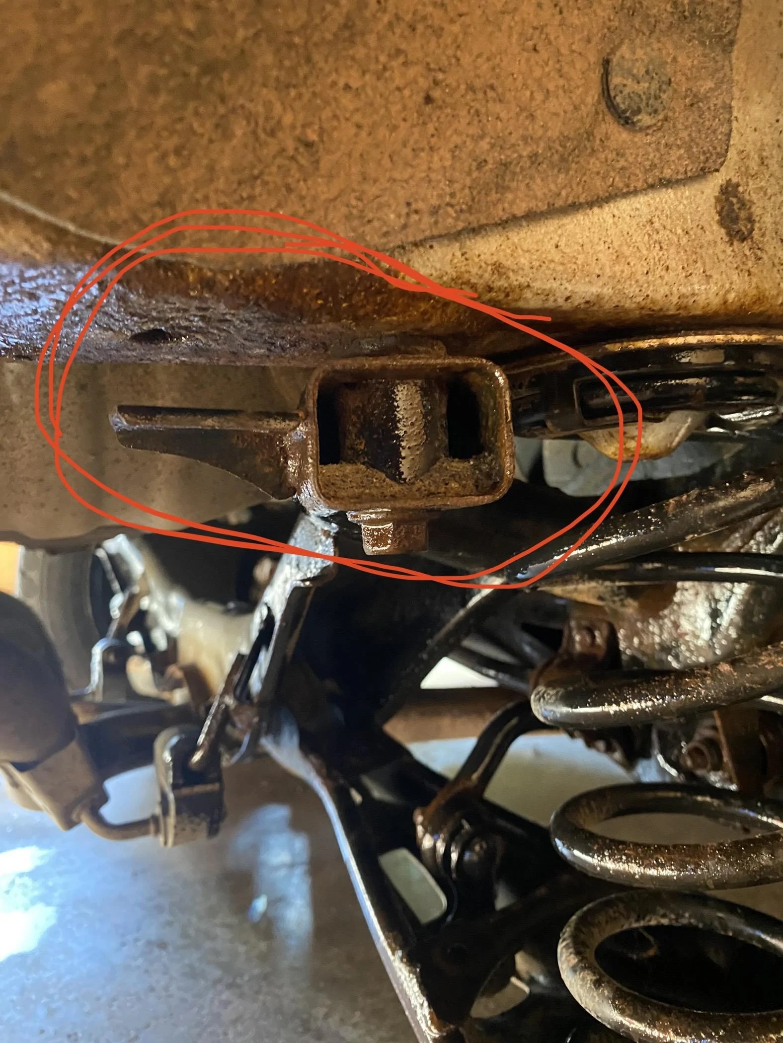 Rear suspension appears to be missing a bolt, what am I looking at