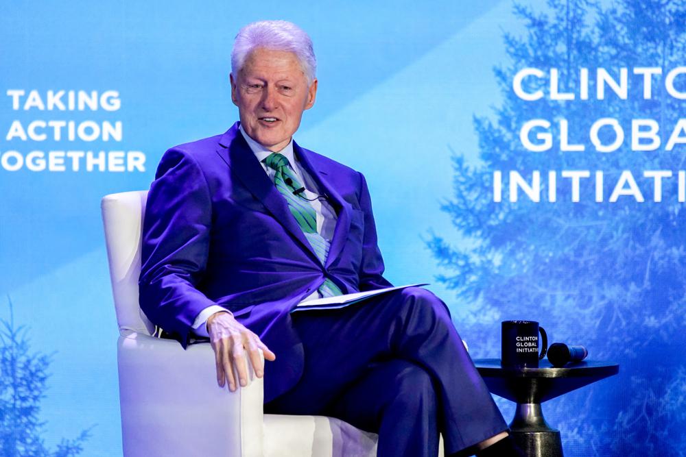 Associated Press "Bill Clinton ‘The world’s on fire,’ but teamwork
