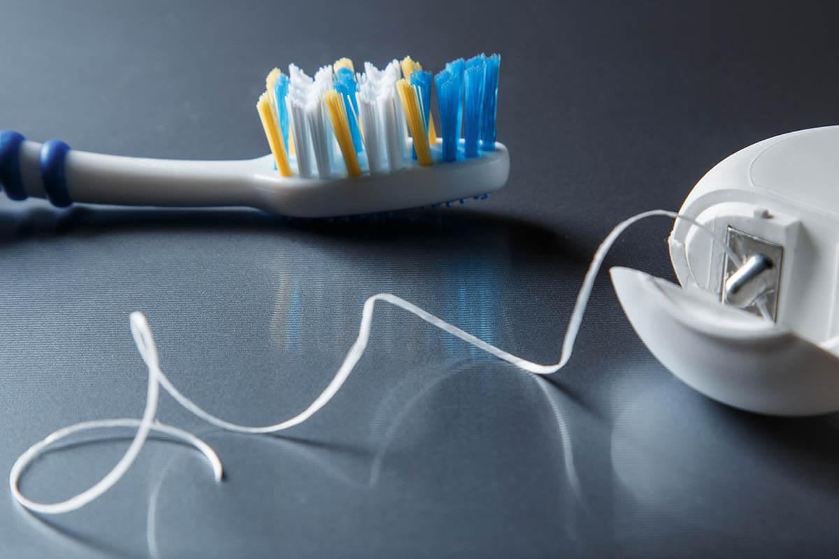 Differences Between Flossing and Brushing Columbia Office