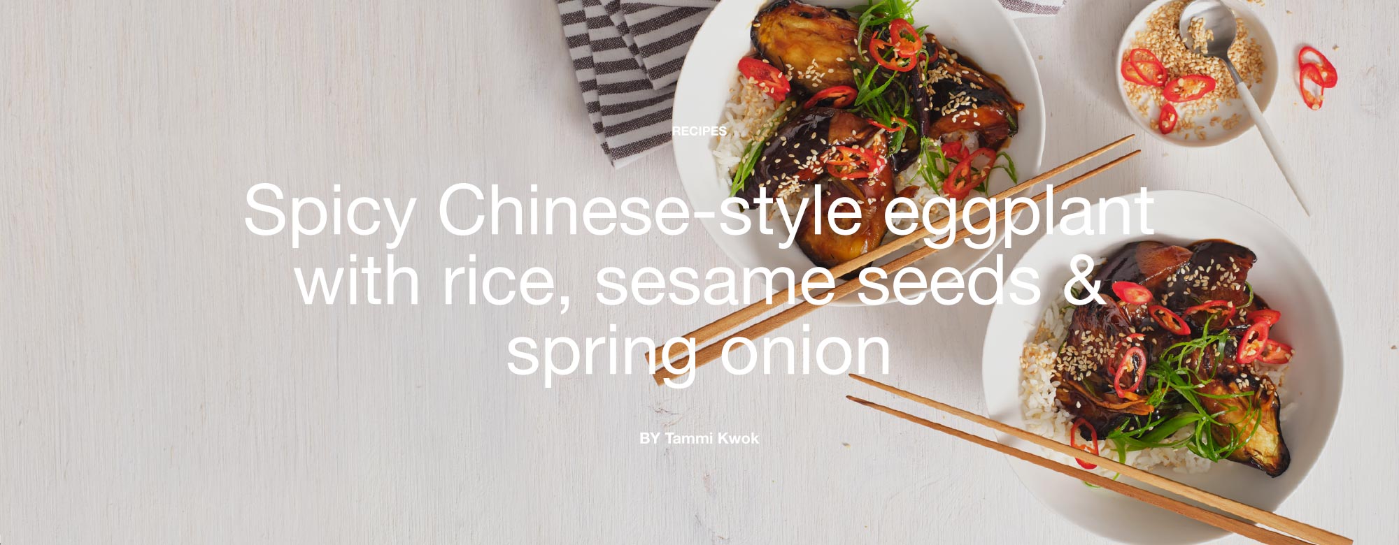 Spicy Chinesestyle eggplant with rice, sesame seeds and spring onion