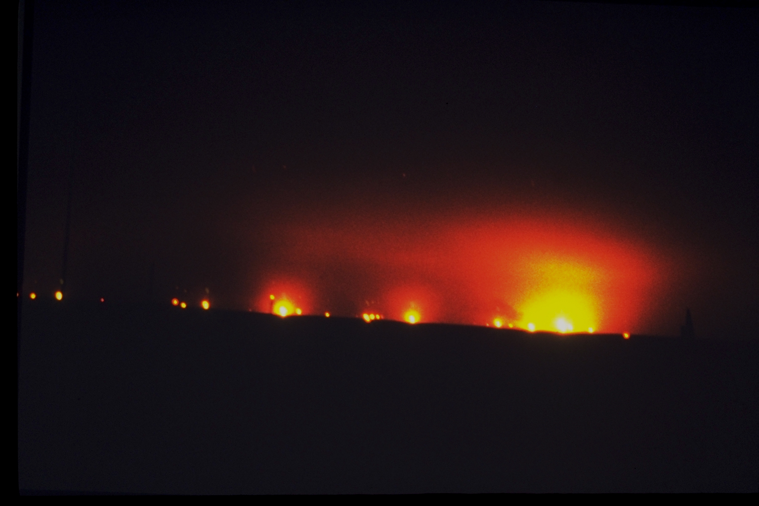 Gulf War, Kuwait's Bergan oil field fires at night CounterSpill