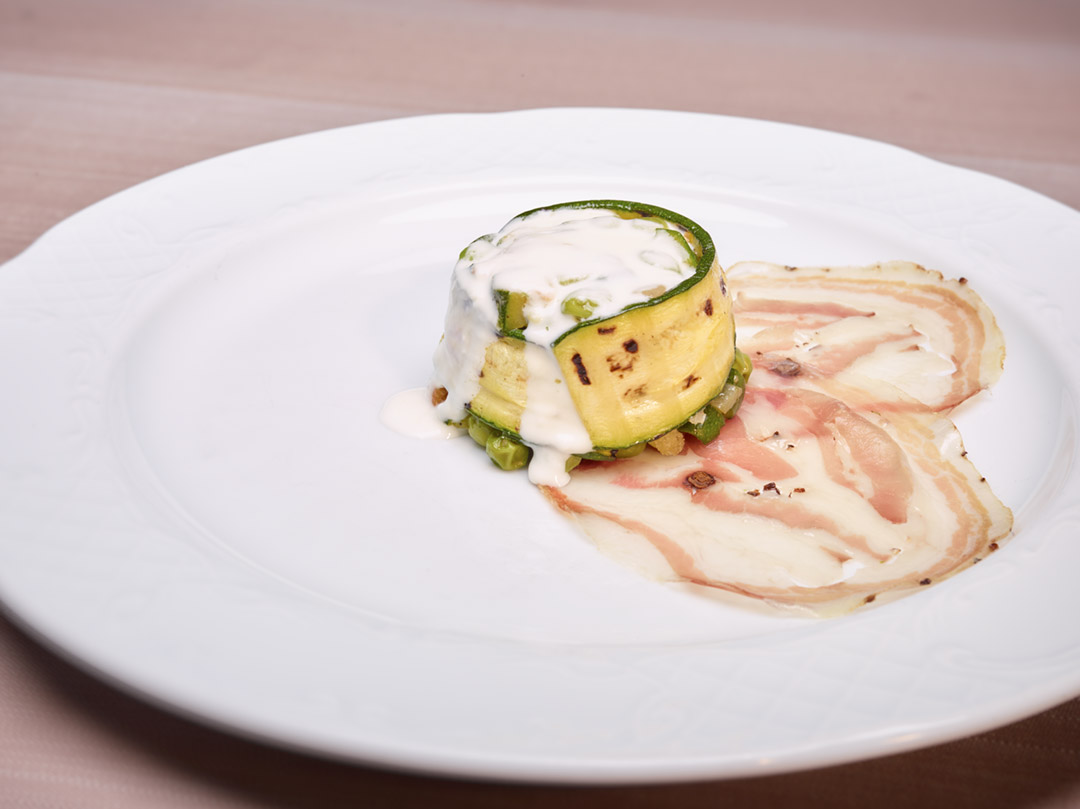 Timbale zucchini and peas with fonduta and ribs da Tullio