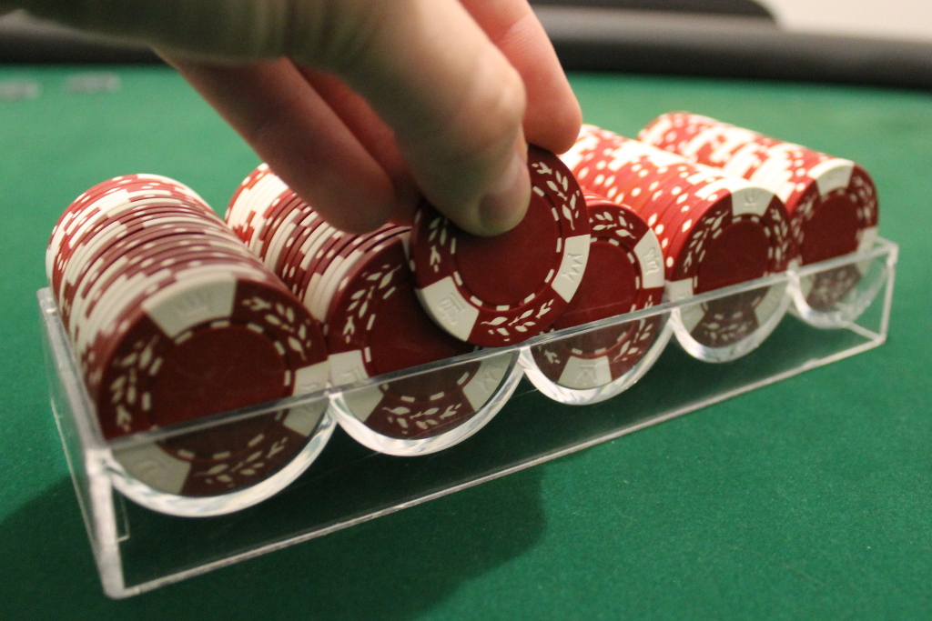Using a chip rack to count poker chips Denexa Games