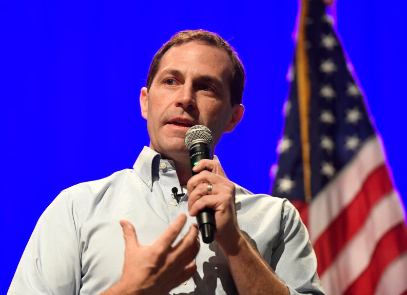 Jason Crow, suburban Democrats campaign on gun control