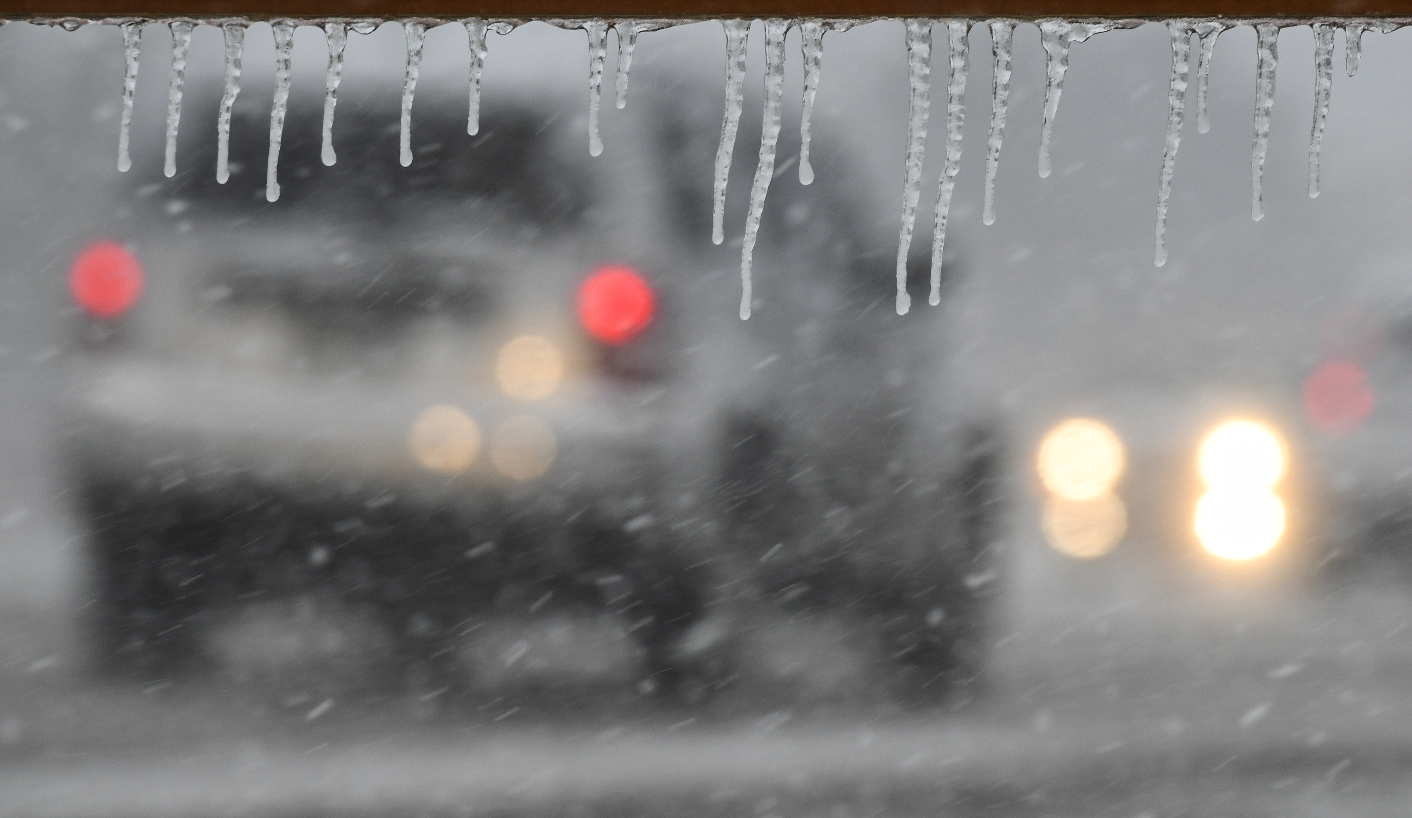 Ice forms on a sign as ...