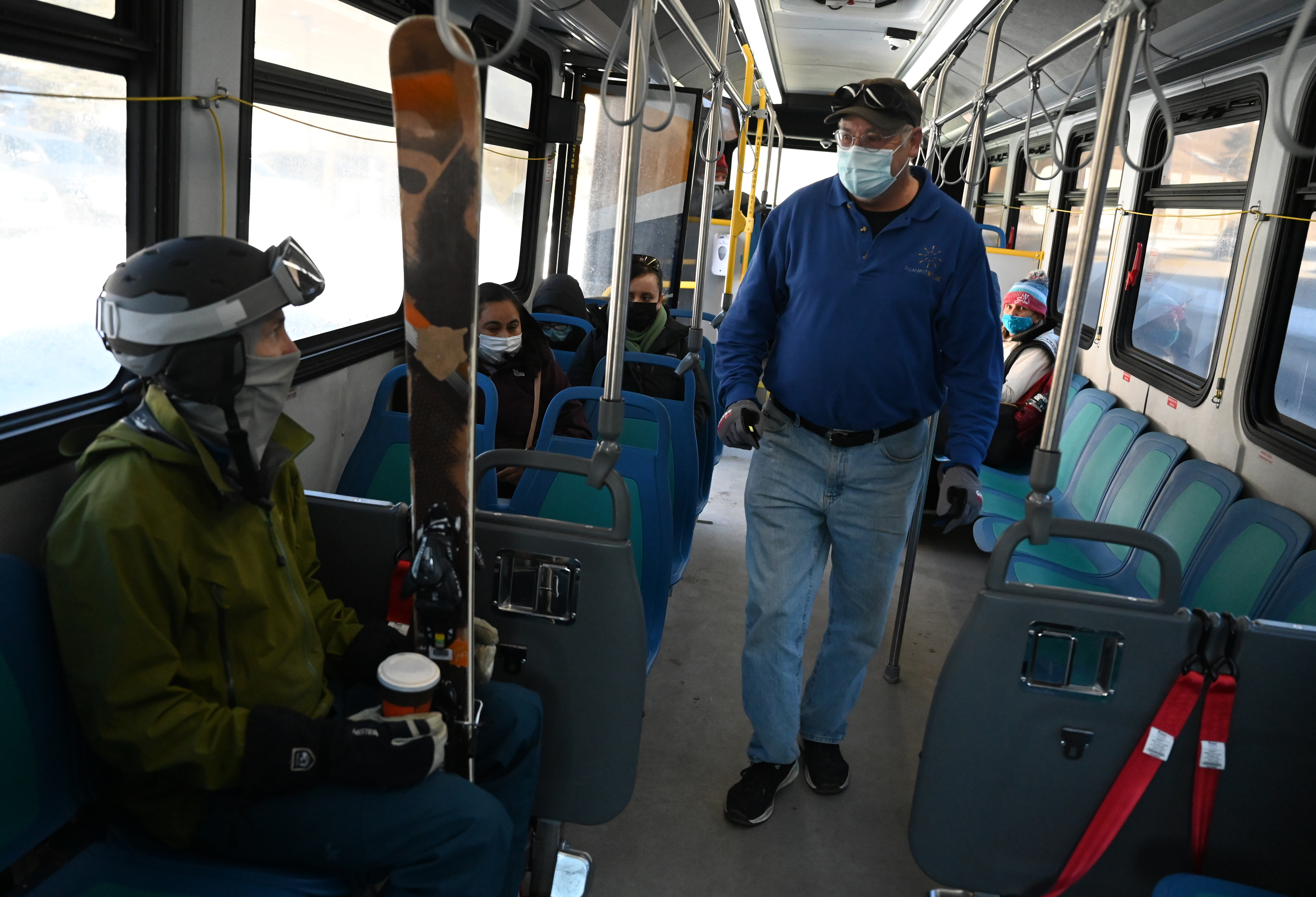 Cliff McAninch talks with passengers riding ...