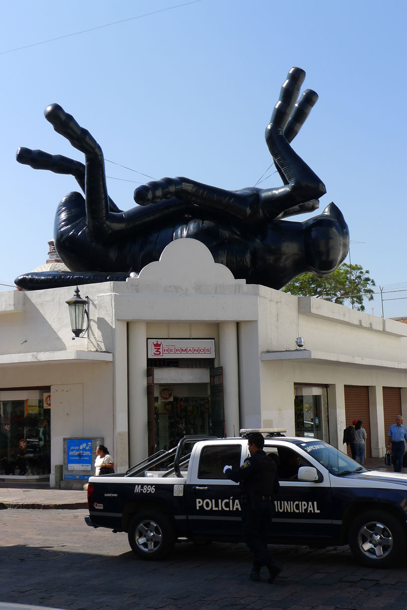 florentijn hofman's giant dead fly looks over the queretaro city