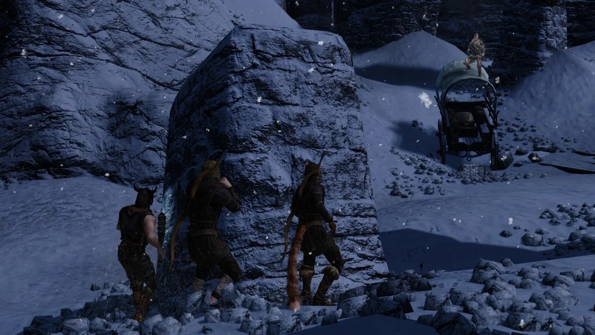Skyrim: NPCs hiding behind a rock while another is stood on a wagon in the distance.