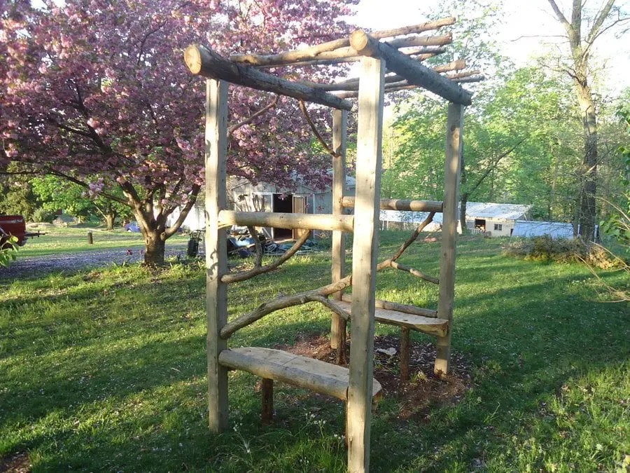 Log arbors, stone benches and other garden features Devine Escapes