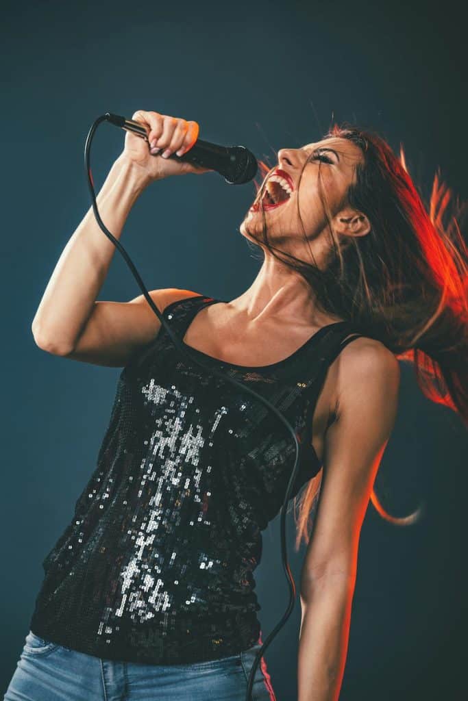 Why Do Singers Wear Earpieces? One Big Reason