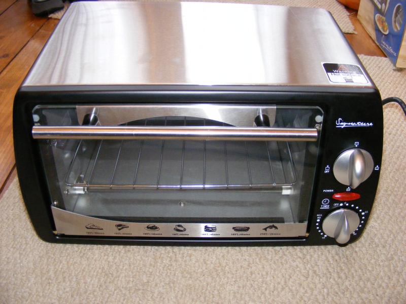 Conversion of toaster oven to SMT reflow oven using cheap PID controller.