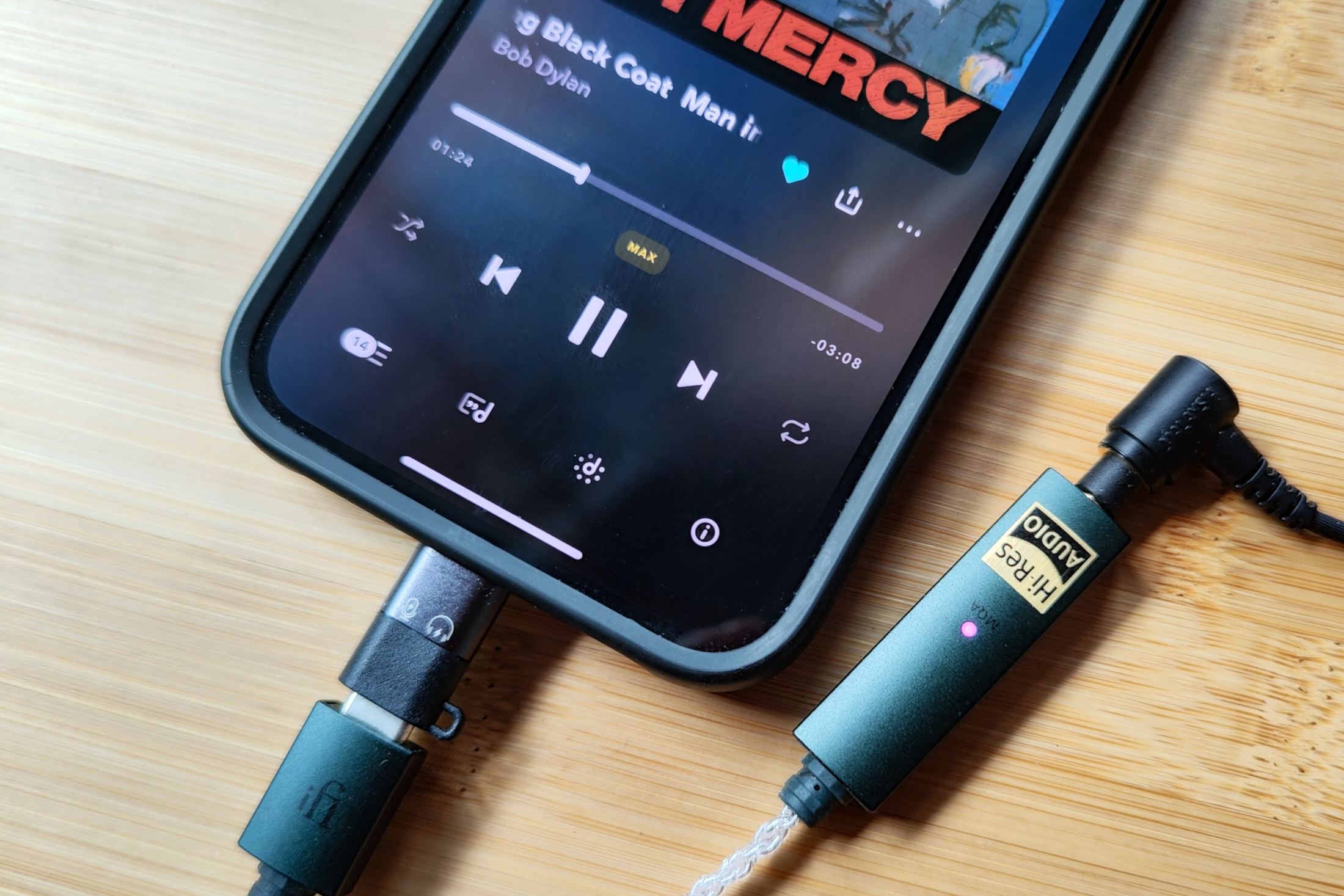 Tidal app for iOS on an iPhone 14 showing now playing screen with Max quality track.