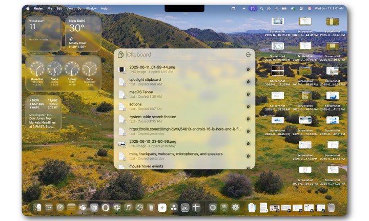 Operating Spotlight within macOS Tahoe on a MacBook Air.