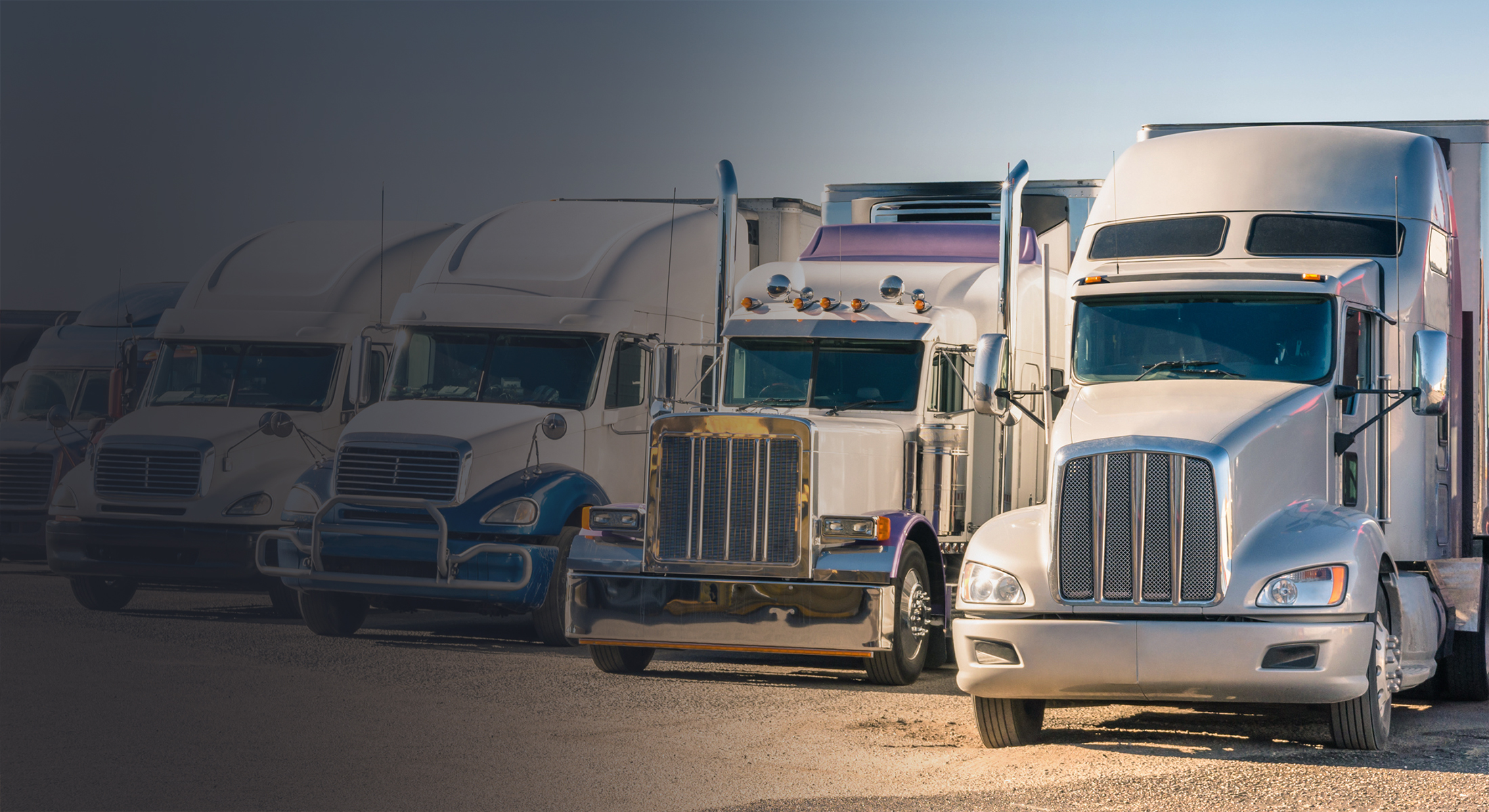 Generic semi Trucks at a parking lot Dimensions Insurance Group