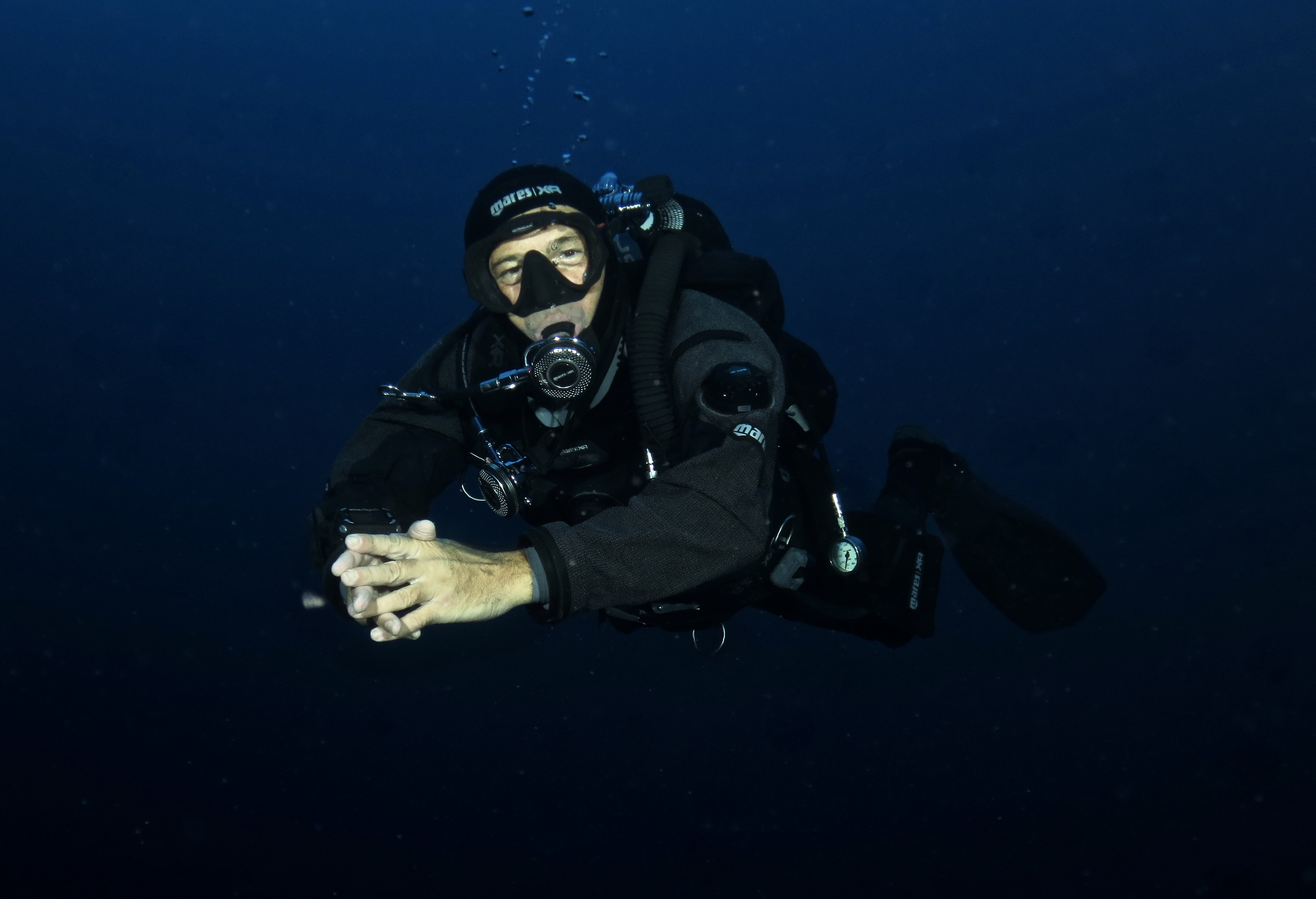Dry Suit Diver Diving in Elba